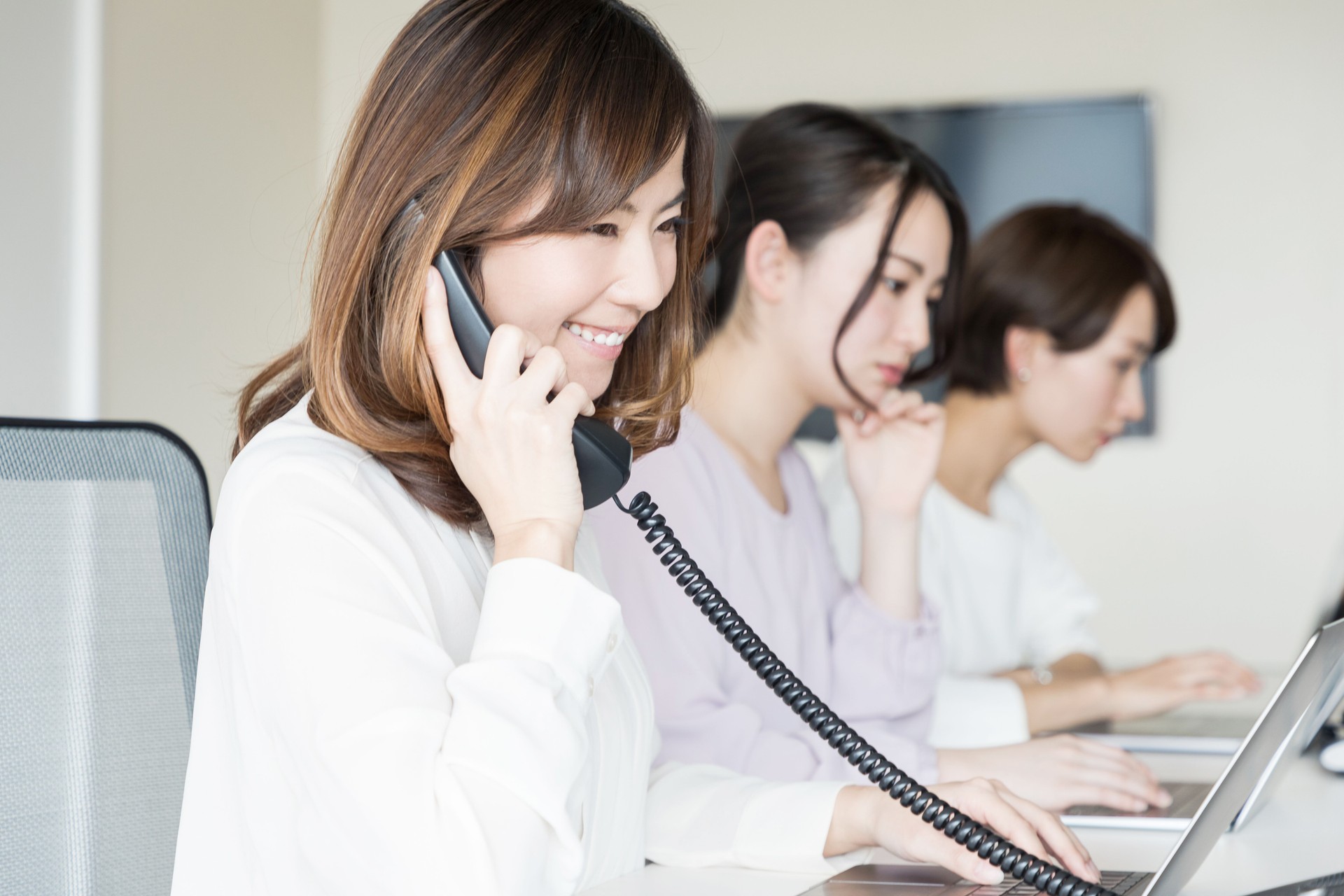 Young woman making a call.